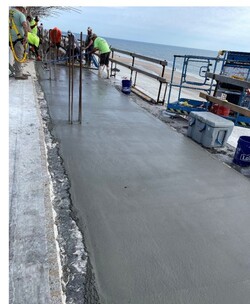 Casting the 6th floor balcony slab in-progress on the South end